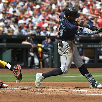 Seattle Mariners center fielder Julio Rodriguez breaks his bat during a game against the St. Louis Cardinals on Sunday at Busch Stadium.