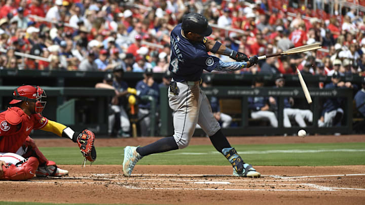 Seattle Mariners center fielder Julio Rodriguez breaks his bat during a game against the St. Louis Cardinals on Sunday at Busch Stadium.