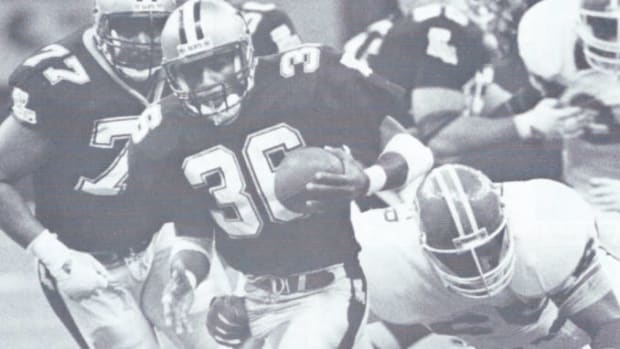 New Orleans Saints running back Rueben Mayes (36) picks up yardage against the Denver Broncos in a 1988 victory 