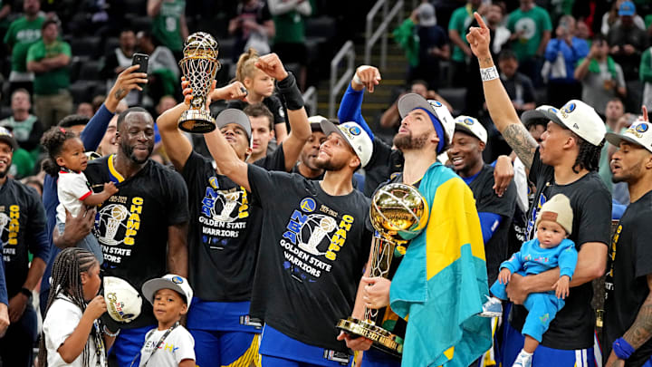 Jun 16, 2022; Boston, Massachusetts, USA; Golden State Warriors guard Stephen Curry (30) celebrates with the MVP trophy after the Golden State Warriors beat the Boston Celtics in game six of the 2022 NBA Finals to win the NBA Championship at TD Garden. Mandatory Credit: Kyle Terada-Imagn Images