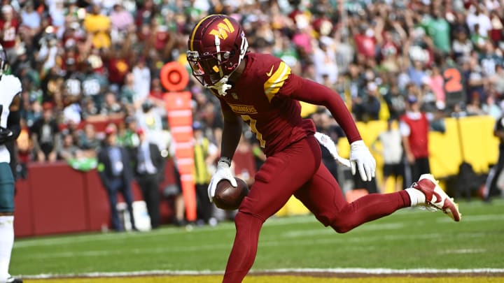 Oct 29, 2023; Landover, Maryland, USA; Washington Commanders wide receiver Jahan Dotson (1) scores a touchdown  against the Philadelphia Eagles during the first half at FedExField. Mandatory Credit: Brad Mills-USA TODAY Sports