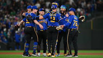 Sep 27, 2024; Seattle, Washington, USA; The Seattle Mariners celebrate defeating the Oakland Athletics at T-Mobile Park. Mandatory Credit: Steven Bisig-Imagn Images