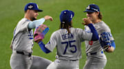 Oct 25, 2025; Toronto, Ontario, CAN; Los Angeles Dodgers center fielder Andy Pages (44) and center fielder Justin Dean (75) and first baseman Enrique Hernandez (8) celebrate after the win against the Toronto Blue Jays in game two of the 2025 MLB World Series at Rogers Centre. Mandatory Credit: Nick Turchiaro-Imagn Images