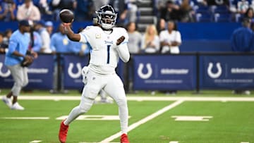Oct 26, 2025; Indianapolis, Indiana, USA;  Tennessee Titans quarterback Cam Ward (1) warms up before the game against the Indianapolis Colts at Lucas Oil Stadium. Mandatory Credit: Robert Goddin-Imagn Images