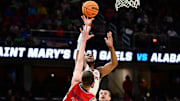 Mar 23, 2025; Cleveland, OH, USA; Alabama Crimson Tide guard Chris Youngblood (8) shoots the ball over St. Mary's Gaels forward Luke Barrett (33) in the first half during the NCAA Tournament Second Round at Rocket Arena