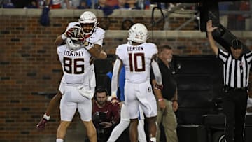 Sep 28, 2024; Dallas, Texas, USA; Florida State Seminoles tight end Landen Thomas (18) and tight end Brian Courtney (86) and wide receiver Malik Benson (10) celebrates a touchdown during the game between the Southern Methodist Mustangs and the Florida State Seminoles at Gerald J. Ford Stadium. Mandatory Credit: Jerome Miron-Imagn Images