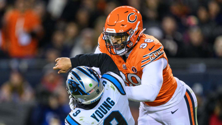 Nov 9, 2023; Chicago, Illinois, USA; Chicago Bears defensive end Montez Sweat (98) hits Carolina Panthers quarterback Bryce Young (9) in during the second quarter at Soldier Field. Mandatory Credit: Daniel Bartel-USA TODAY Sports