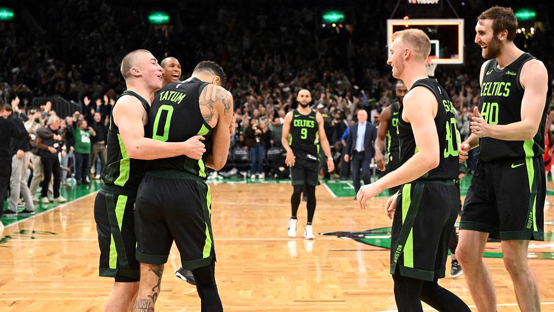 Nov 16, 2024; Boston, Massachusetts, USA; Boston Celtics forward Jayson Tatum (0) celebrates with forward Sam Hauser (30), guard Payton Pritchard (11), and center Luke Kornet (40) after making the game wining basket against the Toronto Raptors in overtime at the TD Garden. Mandatory Credit: Brian Fluharty-Imagn Images