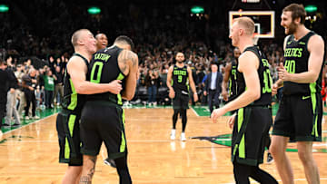 Nov 16, 2024; Boston, Massachusetts, USA; Boston Celtics forward Jayson Tatum (0) celebrates with forward Sam Hauser (30), guard Payton Pritchard (11), and center Luke Kornet (40) after making the game wining basket against the Toronto Raptors in overtime at the TD Garden. Mandatory Credit: Brian Fluharty-Imagn Images