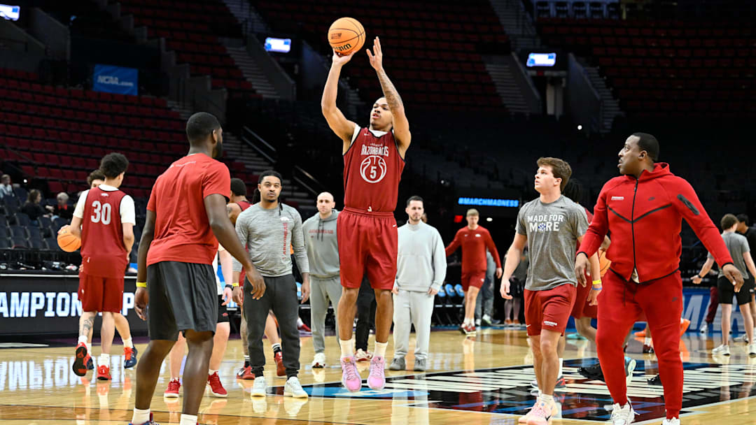 Mar 18, 2026; Portland, OR, USA; Arkansas Razorbacks guard Darius Acuff Jr. (5) shoots the ball while the coaching staff watches during a practice session ahead of the first round of the men's 2026 NCAA Tournament at Moda Center. Mandatory Credit: Craig Strobeck-Imagn Images