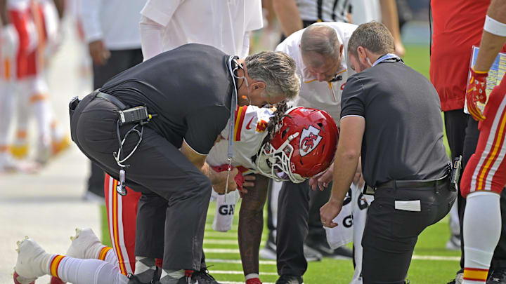 Sep 29, 2024; Inglewood, California, USA;  Kansas City Chiefs wide receiver Rashee Rice (4) pounds his fist on the ground after an injury in the first half against the Los Angeles Chargers at SoFi Stadium. Mandatory Credit: Jayne Kamin-Oncea-Imagn Images