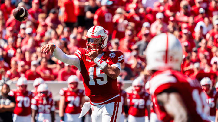 Aug 31, 2024; Lincoln, Nebraska, USA; Nebraska Cornhuskers quarterback Dylan Raiola (15) throws to wide receiver Isaiah Neyor (18) against the UTEP Miners during the second quarter at Memorial Stadium.