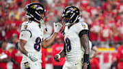 Sep 5, 2024; Kansas City, Missouri, USA; Baltimore Ravens tight end Isaiah Likely (80) talks with quarterback Lamar Jackson (8) after a play against the Kansas City Chiefs during the game at GEHA Field at Arrowhead Stadium. Mandatory Credit: Denny Medley-Imagn Images