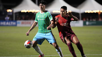 Seattle Sounders midfielder Josh Atencio, left, controls the ball against Sacramento Republic FC forward Sebastian Herrera during the second half at Heart Health Park.