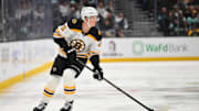 Dec 12, 2024; Seattle, Washington, USA; Boston Bruins center Trent Frederic (11) plays the puck during the second period against the Seattle Kraken at Climate Pledge Arena. Mandatory Credit: Steven Bisig-Imagn Images