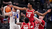 Xavier Amos and Wisconsin are headed to the Big Ten Tournament semifinals to face Michigan State on Saturday.
