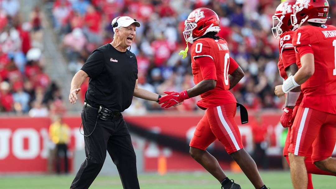 Nov 22, 2025; Houston, Texas, USA; Houston Cougars head coach Willie Fritz celebrates with wide receiver Amare Thomas (0) after Thomas scores a touchdown during the second quarter against the TCU Horned Frogs at TDECU Stadium. Mandatory Credit: Troy Taormina-Imagn Images Nov 22, 2025; Houston, Texas, USA; Houston Cougars head coach Willie Fritz celebrates with wide receiver Amare Thomas (0) after Thomas scores a touchdown during the second quarter against the TCU Horned Frogs at TDECU Stadium. Mandatory Credit: Troy Taormina-Imagn Images