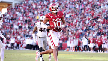 Nov 1, 2025; Fayetteville, Arkansas, USA; Arkansas Razorbacks quarterback Taylen Green (10) scores a touchdown in the third quarter against the Mississippi State Bulldogs at Donald W. Reynolds Razorback Stadium. Bulldogs won 38-35. Mandatory Credit: Nelson Chenault-Imagn Images