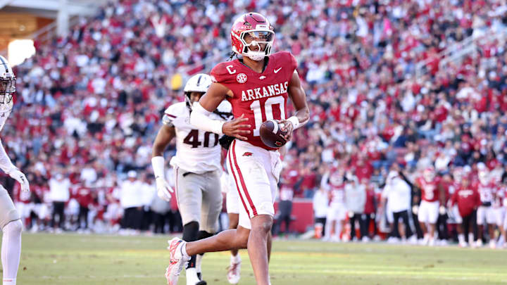 Nov 1, 2025; Fayetteville, Arkansas, USA; Arkansas Razorbacks quarterback Taylen Green (10) scores a touchdown in the third quarter against the Mississippi State Bulldogs at Donald W. Reynolds Razorback Stadium. Bulldogs won 38-35. Mandatory Credit: Nelson Chenault-Imagn Images