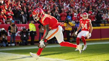 Dec 21, 2024; Kansas City, Missouri, USA; Kansas City Chiefs wide receiver Xavier Worthy (1) scores a touchdown  during the second half against the Houston Texans at GEHA Field at Arrowhead Stadium. Mandatory Credit: Jay Biggerstaff-Imagn Images