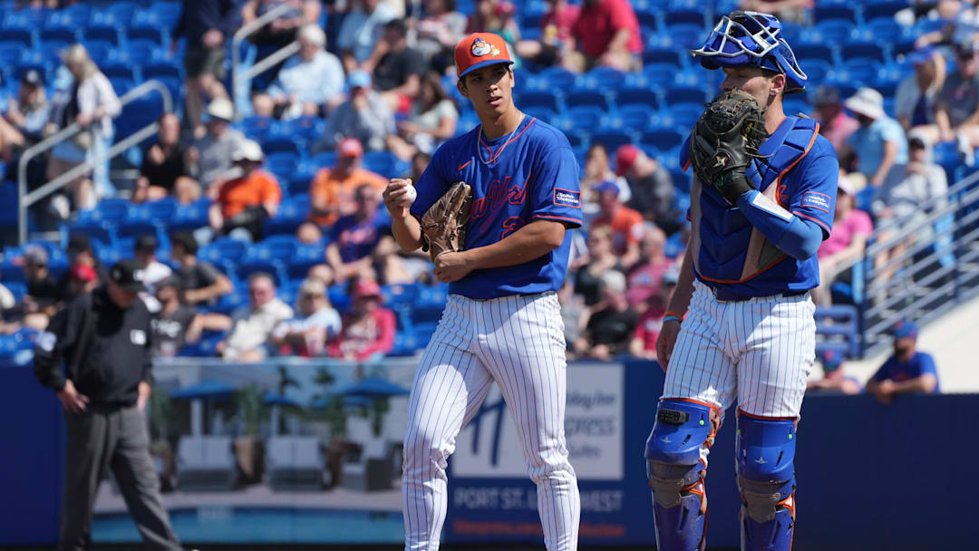 Feb 25, 2026; Port St. Lucie, Florida, USA;  New York Mets pitcher Jonah Tong (21) talks with catcher Hayden Senger (6) after giving up a three-run home run in the third inning to the St. Louis Cardinals at Clover Park. Mandatory Credit: Jim Rassol-Imagn Images