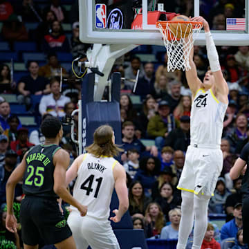 Jan 23, 2024; New Orleans, Louisiana, USA; Utah Jazz center Walker Kessler (24) dunks against New Orleans Pelicans forward Larry Nance Jr. (22) during the first half at Smoothie King Center.