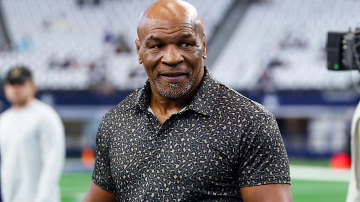 Sep 15, 2024; Arlington, Texas, USA;  Boxer Mike Tyson on the field before the game between the Dallas Cowboys and New Orleans Saints at AT&T Stadium. Mandatory Credit: Kevin Jairaj-Imagn Images