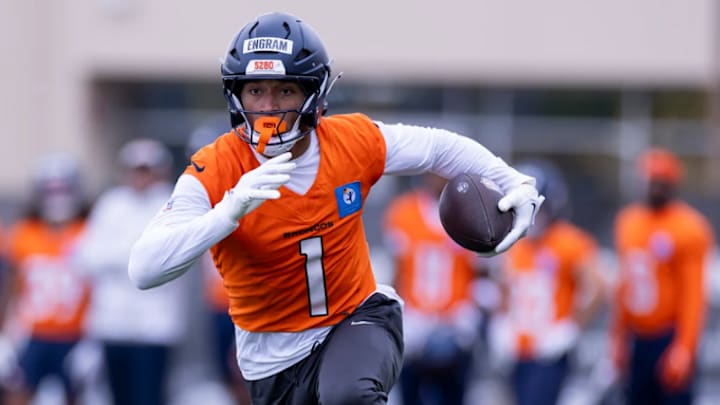 Denver Broncos tight end Evan Engram (1) runs a route during an OTA practice at Broncos Park Powered by CommonSpirit.