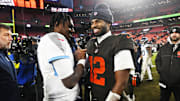Dec 7, 2025; Cleveland, Ohio, USA; Cleveland Browns quarterback Shedeur Sanders (12) shakes hands with Tennessee Titans quarterback Cam Ward (1) after the game at Huntington Bank Field. Mandatory Credit: Ken Blaze-Imagn Images
