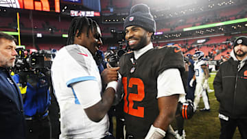 Dec 7, 2025; Cleveland, Ohio, USA; Cleveland Browns quarterback Shedeur Sanders (12) shakes hands with Tennessee Titans quarterback Cam Ward (1) after the game at Huntington Bank Field. Mandatory Credit: Ken Blaze-Imagn Images