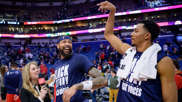 New Orleans Pelicans players celebrate during a post-game interview