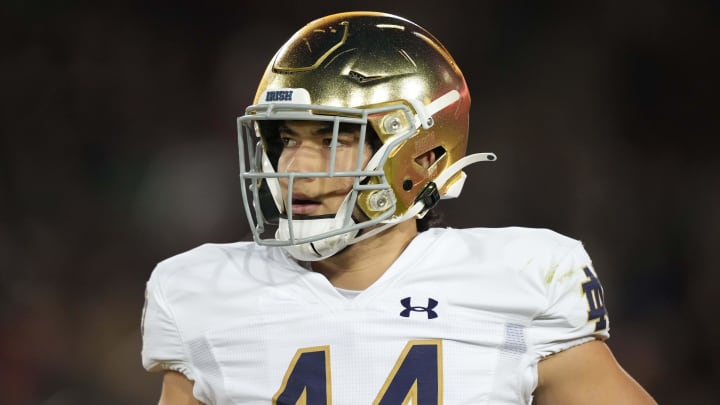 Nov 27, 2021; Stanford, California, USA; Notre Dame Fighting Irish linebacker Kahanu Kia (44) jogs on the field during the second quarter against the Stanford Cardinal at Stanford Stadium.