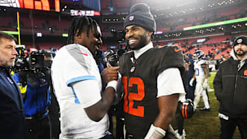 Dec 7, 2025; Cleveland, Ohio, USA; Cleveland Browns quarterback Shedeur Sanders (12) shakes hands with Tennessee Titans quarterback Cam Ward (1) after the game at Huntington Bank Field. Mandatory Credit: Ken Blaze-Imagn Images
