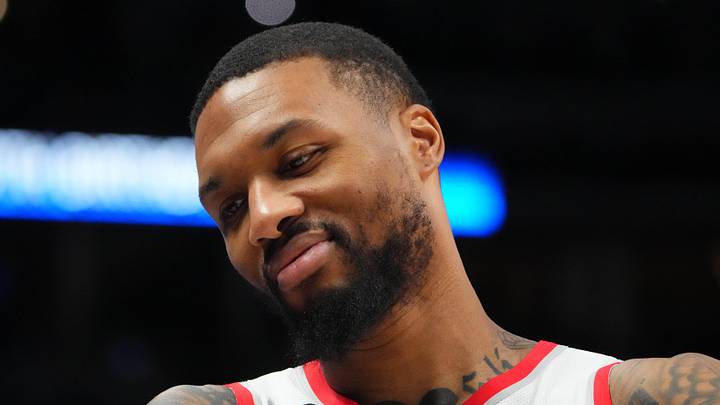 Dec 23, 2022; Denver, Colorado, USA; Portland Trail Blazers guard Damian Lillard (0) reacts towards the Denver Nuggets bench in the second half at Ball Arena. Mandatory Credit: Ron Chenoy-Imagn Images