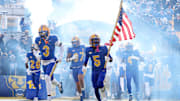 Nov 29, 2025; Pittsburgh, Pennsylvania, USA;  Pittsburgh Panthers linebacker Rasheem Biles (3) and wide receiver Raphael Williams Jr. (5) lead the team onto the field to play the Miami Hurricanes at Acrisure Stadium. Mandatory Credit: Charles LeClaire-Imagn Images