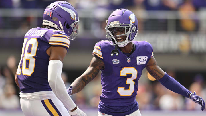 Sep 10, 2023; Minneapolis, Minnesota, USA; Minnesota Vikings wide receiver Jordan Addison (3) reacts with wide receiver Justin Jefferson (18) after scoring his first career touchdown pass from quarterback Kirk Cousins (not pictured) against the Tampa Bay Buccaneers during the second quarter at U.S. Bank Stadium.