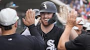 Chicago White Sox first baseman Tim Elko (91) celebrates with teammates after hitting a solo home run against the Chicago Cubs in a spring training game Sloan Park. 