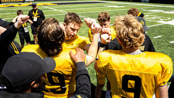 Apr 26, 2025; Iowa City, IA, USA; Iowa quarterbacks (clockwise from left) Jackson Stratton, (19) Mark Gronowski, Jimmy Sullivan and Hank Brown huddle up together after a spring NCAA football open practice at Kinnick Stadium. Mandatory Credit: Joseph Cress-The Des Moines Register
