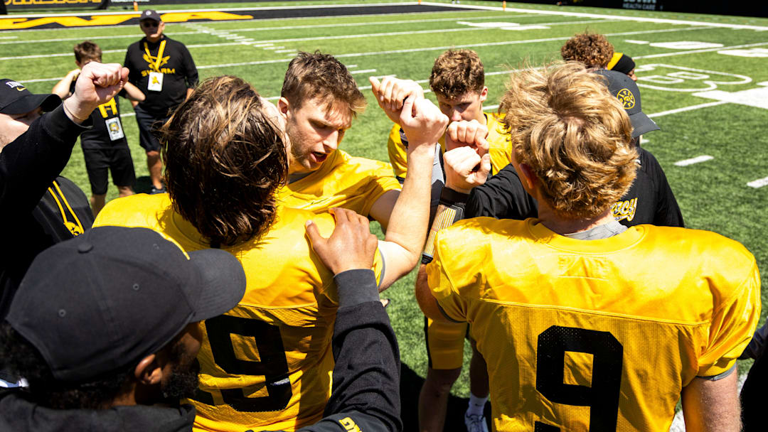 Apr 26, 2025; Iowa City, IA, USA; Iowa quarterbacks (clockwise from left) Jackson Stratton, (19) Mark Gronowski, Jimmy Sullivan and Hank Brown huddle up together after a spring NCAA football open practice at Kinnick Stadium. Mandatory Credit: Joseph Cress-The Des Moines Register Apr 26, 2025; Iowa City, IA, USA; Iowa quarterbacks (clockwise from left) Jackson Stratton, (19) Mark Gronowski, Jimmy Sullivan and Hank Brown huddle up together after a spring NCAA football open practice at Kinnick Stadium. Mandatory Credit: Joseph Cress-The Des Moines Register