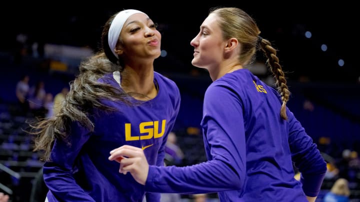 Feb 4, 2024; Baton Rouge, Louisiana, USA; LSU Lady Tigers forward Angel Reese, left, and guard Izzy Besselman practice a handshake celebration routine that ends with air kisses before a game against the Florida Gators at Pete Maravich Assembly Center. Mandatory Credit: Matthew Hinton-USA TODAY Sports