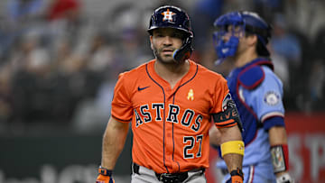 Sep 7, 2025; Arlington, Texas, USA; Houston Astros designated hitter Jose Altuve (27) reacts to striking out against the Texas Rangers during the fourth inning at Globe Life Field. Mandatory Credit: Jerome Miron-Imagn Images