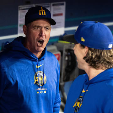 Seattle Mariners manager Dan Wilson, left, yells to starting pitcher Logan Gilbert #36 of the Seattle Mariners in the dugout before a game against the San Francisco Giants at T-Mobile Park on Aug 23.