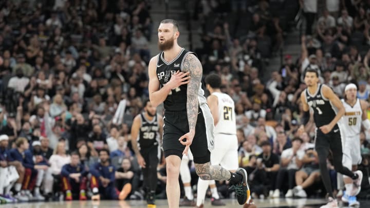 Apr 12, 2024; San Antonio, Texas, USA; San Antonio Spurs forward Sandro Mamukelashvili (54) reacts after scoring a three-point basket during the second half against the Denver Nuggets at Frost Bank Center. Mandatory Credit: Scott Wachter-USA TODAY Sports