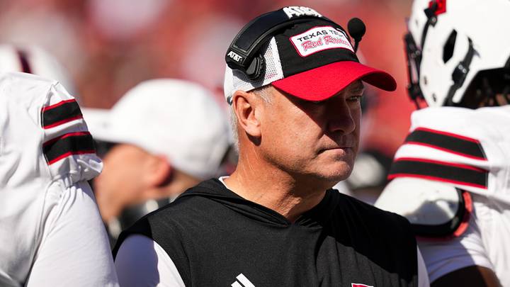 Oct 24, 2026; Cincinnati, Ohio, USA;  Texas Tech Red Raiders head coach Joey McGuire stands on the field with his team during a stop in play against the Cincinnati Bearcats in the first half at Nippert Stadium. Mandatory Credit: Aaron Doster-Imagn Images