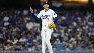 Apr 12, 2025; Los Angeles, California, USA; Los Angeles Dodgers pitcher Roki Sasaki (11) reacts after a pitch against the Chicago Cubs during the fifth inning at Dodger Stadium. Mandatory Credit: Kiyoshi Mio-Imagn Images