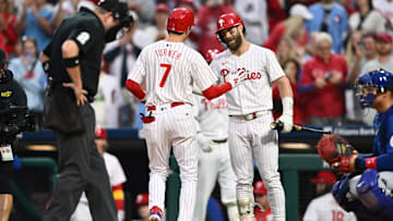 Sep 25, 2024; Philadelphia, Pennsylvania, USA; Philadelphia Phillies shortstop Trea Turner (7) reacts with first baseman Bryce Harper (3) after hitting a home run against the Chicago Cubs in the first inning at Citizens Bank Park. Mandatory Credit: Kyle Ross-Imagn Images