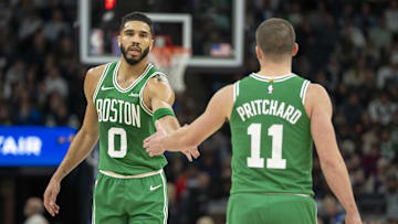 Jan 2, 2025; Minneapolis, Minnesota, USA; Boston Celtics forward Jayson Tatum (0) celebrates with guard Payton Pritchard (11) after making a shot against the Minnesota Timberwolves in the first half at Target Center. Mandatory Credit: Jesse Johnson-Imagn Images