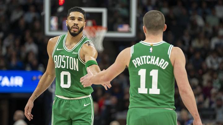 Jan 2, 2025; Minneapolis, Minnesota, USA; Boston Celtics forward Jayson Tatum (0) celebrates with guard Payton Pritchard (11) after making a shot against the Minnesota Timberwolves in the first half at Target Center. Mandatory Credit: Jesse Johnson-Imagn ImagesJ