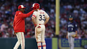 Jun 6, 2025; Anaheim, California, USA; Los Angeles Angels manager Ron Washington (37) talks to outfielder Chris Taylor (33) after he doubled during the fourth inning against the Seattle Mariners at Angel Stadium. Mandatory Credit: Jason Parkhurst-Imagn Images