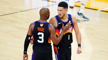 Jul 6, 2021; Phoenix, Arizona, USA; Phoenix Suns guard Devin Booker (1) and Chris Paul (3) against the Milwaukee Bucks during game one of the 2021 NBA Finals at Phoenix Suns Arena. Mandatory Credit: Mark J. Rebilas-Imagn Images
